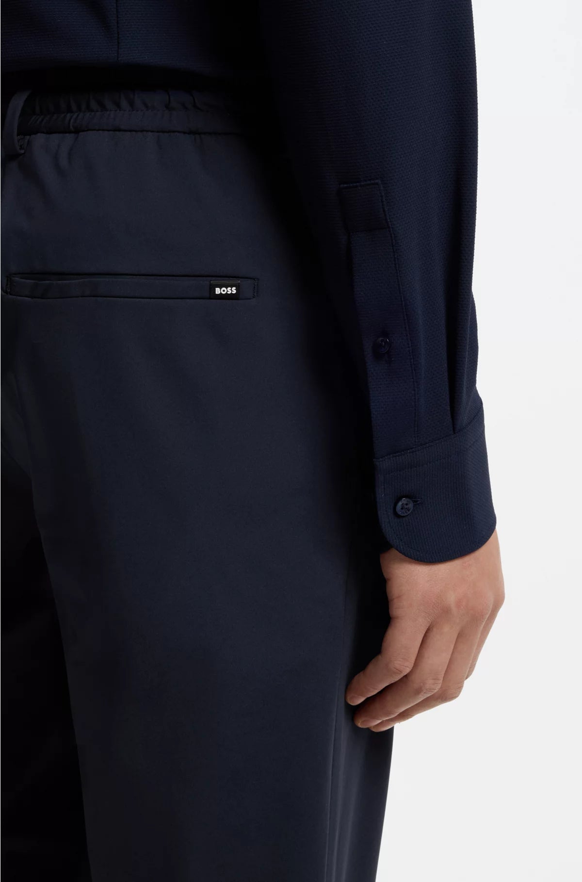 SLIM-FIT TROUSERS IN PERFORMANCE-STRETCH JERSEY
